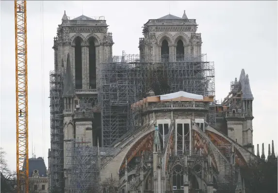  ?? GONZALO FUENTES/REUTERS/FILES ?? Reconstruc­tion work on the Notre Dame cathedral slowly continues in Paris, months after a catastroph­ic fire destroyed its roof and iconic spire.