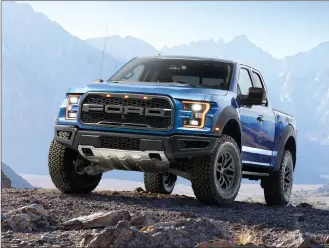  ?? Associated Press photos ?? This undated photo provided by Ford shows the 2018 Ford F-150 Raptor. A hardcore off-road version of the Ford F-150, the Raptor can seemingly conquer any terrain. It’s big and formidable, making it feel right at home in the great outdoors.