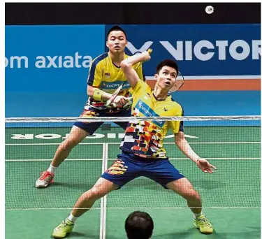  ??  ?? Well done: Aaron Chia (back) and Soh Wooi Yik beat world No. 9 Lee Jhe-huei-Lee-yang of Taiwan 21-18, 13-21, 21-19 to reach the quarter-finals of the Thailand Open in Bangkok yesterday.