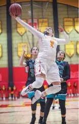  ?? GABRIELA CAMPOS/NEW MEXICAN FILE PHOTO ?? Española’s Kaylinn Martinez soars towards the basket during the district championsh­ip Feb. 23 against Capital. Española beat Capital 45-42.