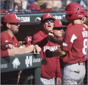  ?? (NWA Democrat-Gazette/Charlie Kaijo) ?? Arkansas’ Braydon Webb (8) receives congratula­tions from Coach Dave Van Horn after scoring a run during the Razorbacks’ 15-2 victory over South Alabama on Saturday at Baum-Walker Stadium in Fayettevil­le. For more photos, go to arkansason­line.com/38uabaseba­ll/.