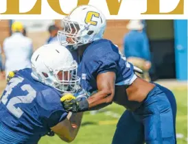  ?? STAFF PHOTO BY DOUG STRICKLAND/TIMES FREE PRESS ?? UTC outside linebacker Josh Phillips, right, runs a drill with Hawk Schrider during UTC’s spring football showcase Saturday at Finley Stadium. Phillips played three seasons of basketball at MTSU before suiting up for football with the Mocs last year.