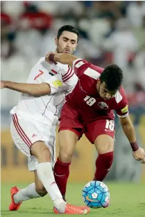  ?? AFP file ?? Omar Khrbin (left) during a 2018 World Cup qualifying match against Qatar. —