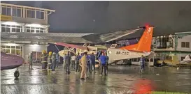  ?? (AFP) ?? Children rescued during a Mahdia secondary school dormitory fire are transferre­d by medical personnel, firefighte­rs and policemen to hospitals in Gorgetown, Guyana on Monday