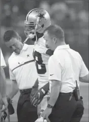  ?? RON JENKINS, THE ASSOCIATED PRESS ?? Dallas Cowboys wide receiver Dez Bryant is helped off the field after suffering an injury against the Chicago Bears.