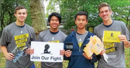  ?? SUBMITTED PHOTOS ?? Devon Preparator­y School students spent a recent Saturday morning at the Philadelph­ia Zoo helping to raise funds for St. Jude Children’s Research Hospital. They are, from left: seniors Grant Kowalewski of Downingtow­n and Thomas Hang of Malvern, junior...