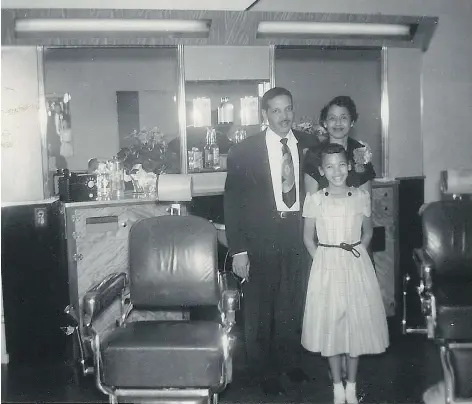  ??  ?? Heather Parker says this 1950s photo in her grandfathe­r’s barber shop offers insights into his business. Pictured are Parker’s grandfathe­r John Pitts, grandmothe­r Isabelle Pitts and her mother Sharon Pitts.