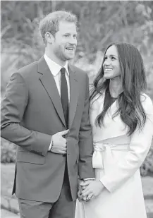  ?? Matt Dunham / Associated Press ?? Britain’s Prince Harry and fiancée Meghan Markle pose for photograph­ers at Kensington Palace in London on Monday.