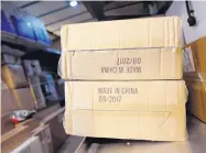  ?? MARK LENNIHAN/ASSOCIATED PRESS ?? Packages labeled “Made in China” are loaded for delivery in New York. The U.S. will impose tariffs on $200 billion of Chinese goods starting next week.