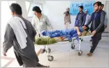  ??  ?? REUTERS A man wounded in the attack at Spinghar Cricket Ground in Jalalabad, Afghanista­n, was treated in a hospital on Saturday.