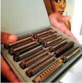  ?? Staff pohto by Aaron Brand ?? Cedric Watson shows his collection of harmonicas.