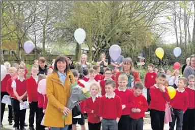  ??  ?? Garden designer Marissa Ewing-Gerrard with pupils of Croft CE Primary School where she led the design of a new woodland garden as part of a £20,000 transforma­tion of a piece of scrubland on the school site which was officially opened as a school and...