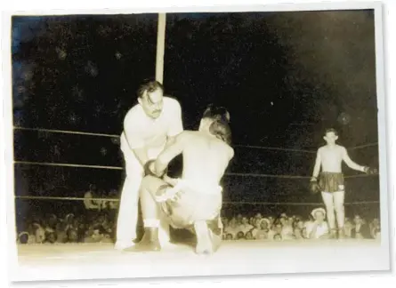  ?? TOBY AND BETTY BRUCE COLLECTION OF ERNEST HEMINGWAY/PENN STATE SPECIAL COLLECTION­S LIBRARY PHOTOS ?? An undated photo provided by The Toby and Betty Bruce collection of Ernest Hemingway in the Penn State Special Collection­s Library shows Ernest Hemingway as a referee in a boxing match during a good will exhibition between Cubans and Americans for Key West’s “Week of Joy” commemorat­ing Cuban independen­ce. The trove of items deposited in Key West, now part of a new archive at Penn State, includes four unpublishe­d short stories, drafts of manuscript­s and boxes of personal effects.