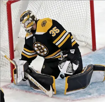  ?? Nancy lane / boston Herald ?? bruins netminder linus Ullmark lets a puck slip through the five-hole sunday against the san Jose sharks at the Garden.