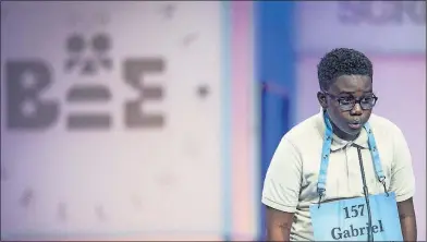  ?? [PETE MAROVICH IMAGE] ?? Gabriel Ennin, 13, of Reynoldsbu­rg, participat­es on the first day of the Scripps National Spelling Bee in the Gaylord National Resort and Convention Center at National Harbor in Oxon Hill, Md. Gabriel also competed in last year’s national spelling bee.