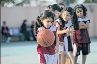  ??  ?? In this 2014 photo, Saudi and expatriate girls practice basketball at a private sports club in Jiddah, Saudi Arabia. Saudi Arabia’s Education Ministry will introduce physical education classes for girls in public schools next year, a decision that...