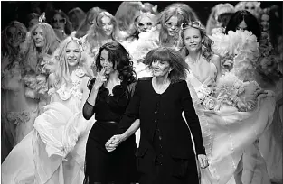  ?? Associated Press ?? French designers Sonia Rykiel, right, and her daughter Nathalie Rykiel, artistic director for the fashion house Rykiel, acknowledg­e applause after the presentati­on of their Spring-Summer 2008 Ready-to-Wear collection on Oct. 5, 2007, in Paris.