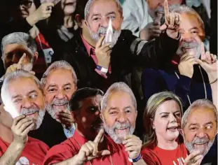  ?? Zanone Fraissat/folhapress ?? Militantes e a presidente do PT, Gleisi Hoffmann, usam máscaras do candidato à Presidênci­a Lula, no encontro nacional do partido, ontem, em São Paulo