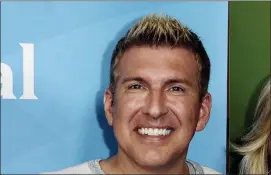  ?? PHOTO BY RICHARD SHOTWELL — INVISION — AP, FILE ?? In this file photo, Todd Chrisley attends the NBC 2014 Summer TCA at the Beverly Hilton Hotel in Beverly Hills A federal grand jury in Atlanta on Tuesday indicted reality television star Chrisley on tax evasion and other charges.