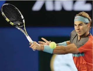  ??  ?? BRISBANE: This file photo taken on January 26, 2014 shows Spain’s Rafael Nadal playing a shot against Switzerlan­d’s Stanislas Wawrinka during the men’s singles final at the 2014 Australian Open tennis tournament in Melbourne. Spanish great Nadal will...