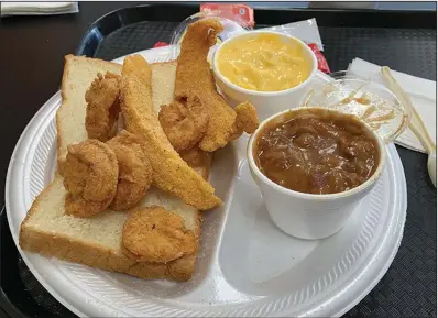  ?? (Arkansas Democrat-Gazette/Eric E. Harrison) ?? Catfish Tenders & 5 pc Shrimps, a lunch special, also comes with two sides (red beans and rice and mac & cheese).