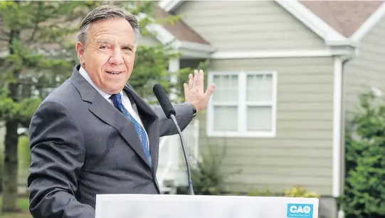  ?? THE CANADIAN PRESS/PETER MCCABE ?? Coalition Avenir Québec Leader François Legault has restated another pledge he made back in January: to offer a single, provincewi­de school-tax rate.