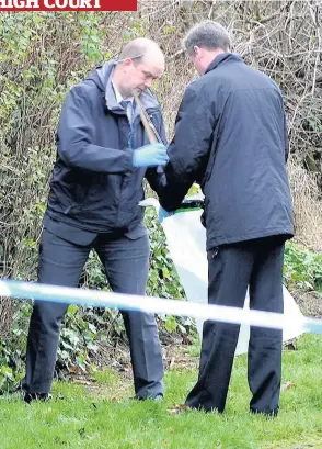  ??  ?? Evidence Police find a baseball bat in nearby bushes