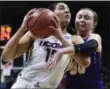  ?? JESSICA HILL — THE ASSOCIATED PRESS ?? Albany’s Mackenzie Trpcic, right, fouls Connecticu­t’s Gabby Williams, left, during a first round game in the NCAA Tournament on Saturday in Storrs, Conn.