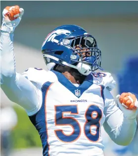  ?? BRUCE KLUCKHOHN/AP ?? Broncos linebacker Von Miller leads Vikings fans in a cheer during a joint training camp practice Aug. 12 in Eagan, Minn.