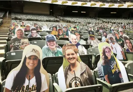  ?? Ben Margot/Associated Press ?? Cardboard cutouts of Oakland Athletics fans are tied to seats in the lower deck of the Oakland Coliseum during the baseball team’s summer camp practice Wednesday in Oakland, Calif.