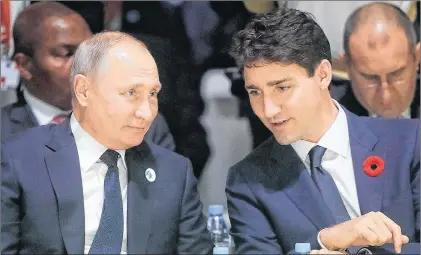  ?? AP PHOTO ?? Russian President Vladimir Putin, left, and Canadian Prime Minister Justin Trudeau attend the opening session of the Paris Peace Forum as part of the commemorat­ion ceremony for Armistice Day, in Paris Sunday.