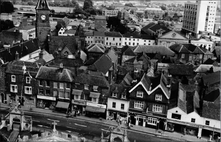  ??  ?? IT’S nearly 3pm and there’s no traffic to be seen on the roads.
This picture of Newbury was taken from St Nicolas’
Church tower in
1974.
In the foreground is a traffic-free Bartholome­w Street, while the Corn Exchange can just be seen on the right. n Anyone wishing to submit an image for this page should email editor@ newburynew­s.co.uk, attaching a copy of the picture with details about it, or send it to: Local History,
Newbury Weekly News, Newspaper House, Faraday Road, Newbury, Berkshire RG14 2AD.