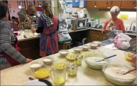  ?? SUBMITTED PHOTO - JIM FARNSWORTH ?? Twenty people of all ages gathered to make more than 70 dozen fastnaught­s at St. Mark’s Evangelica­l Lutheran Church, Birdsboro, on Feb. 10.