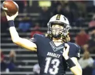  ?? STAFF FILE PHOTO BY C. B. SCHMELTER ?? Bradley Central quarterbac­k Aiden McClary and the Bears beat host Farragut in the opening round of the TSSAA Class 6A playoffs on Friday night.