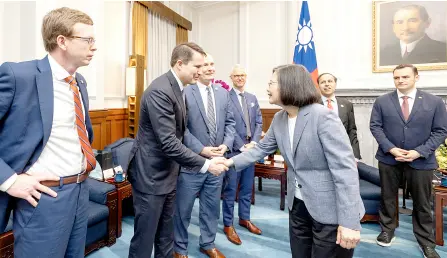  ?? — AFP photo ?? Tsai shaking hands with Gallagher (right) at the Presidenti­al Office in Taipei.