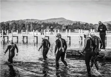  ??  ?? Above: Lake Windermere and a racing journey into the unknown. Below: Christian Bouet emerges from Waterhead Bay ready to put his 4hr-a-week bike training to the test.