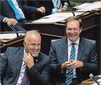  ?? CHRISTOPHE­R KATSAROV THE CANADIAN PRESS ?? Todd Smith, left, is the MPP for the area where the White Pines Project is being built. He questioned why Ontario’s Independen­t Electricit­y System Operator gave the final approval for the project during the spring election campaign. “There’s a lot of...