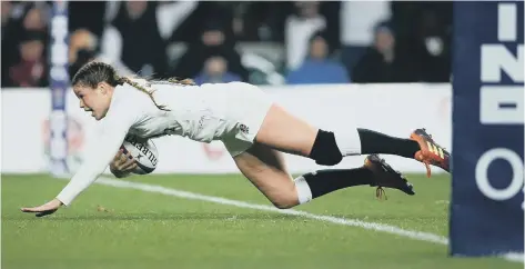  ?? PICTURES FROM RFU COLLECTION VIA GETTY IMAGES ?? Jess Breach dives over for one of her tries against Scotland in the win that clinched the Grand Slam