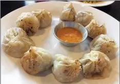  ?? Arkansas Democrat-Gazette/ERIC E. HARRISON ?? Khotay Momo — pan-fried dumplings — are among the varieties available at the full-service, sit-down Katmandu MoMo in Conway that you can’t get at the River Market kiosk or from the food truck.