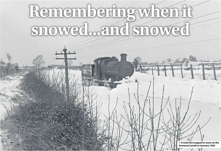  ??  ?? > A train lies trapped in snow on the Somerset Levels in January 1963