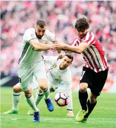  ?? AFP photo ?? Real Madrid's French forward Karim Benzema (L) vies with Athletic Bilbao's defender Yeray Alvarez (R) during the Spanish league football match Athletic Club Bilbao vs Real Madrid CF at the San Mames stadium in Bilbao on March 18, 2017.—