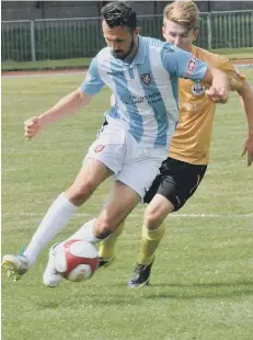  ??  ?? Alex Peterson holds off a Goole defender