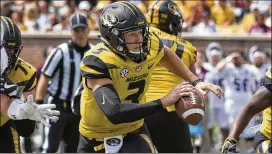  ?? AP PHOTOS ?? Missouri’s Drew Lock (left) and Ole Miss’ Shea Patterson compiled impressive passing statistics in their teams’ opening victories last weekend.