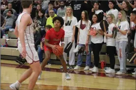  ?? Photo by Nick Woodlock ?? Brayden Devito sets up for a three for Shelby against Willard. The Whippets’ sophomore nailed five threes and scored 17 points in Shelby’s victorious regular season finale Feb. 24.