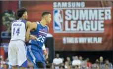  ?? BRETT LE BLANC — LAS VEGAS REVIEW-JOURNAL VIA AP, FILE ?? In this file photo, Ben Simmons (25) and Brandon Ingram (14) battle for position during an NBA summer league game at the Thomas &amp; Mack Center in Las Vegas. The NBA will experiment with a coaches’ challenge for summer league games, one where teams will have the ability to seek a review of certain calls in the final 2 minutes of regulation and overtime. Another new twist this summer is a rule that will see the shot clock reset to 14 seconds instead of 24 after offensive rebounds.