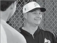  ?? DANA JENSEN/THE DAY ?? In this June 2013 Day file photo, Mystic Schooners manager Phil Orbe talks with one of his players before a baseball game at Fitch High School in Groton.