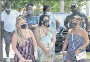  ?? MARTA LAVANDIER — THE ASSOCIATED PRESS ?? A group wAits to get A COVID-19 test SAturdAy in North MiAmi, FlA. FederAl heAlth offiCiAls sAy FloridA hAs reported 21,683 new CAses of COVID-19, the stAte’s highest onedAy totAl sinCe the stArt of the pAndemiC.