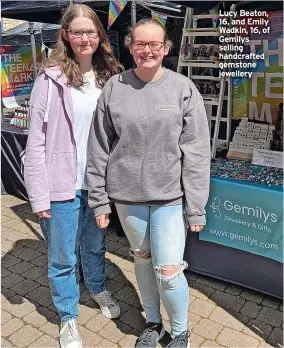  ?? ?? Lucy Beaton, 16, and Emily Wadkin, 16, of Gemilys selling handcrafte­d gemstone jewellery