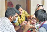  ?? BHUSHAN KOYANDE/HT PHOTO ?? A healthcare worker administer­s a vaccine to a child at a temporary vaccinatio­n camp on Friday.