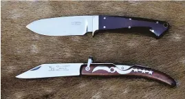  ??  ?? This Rob Brown hunter (top), is the first custom knife I ever owned and still use. While cheap and ugly, the Okapi (bottom) is not worthless at all. Okapi knives have probably skinned more game in South Africa than any other brand name knife.